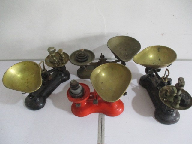 A collection of four vintage weighing scales with brass weights