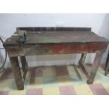 A vintage workbench with vice