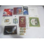A collection of uncirculated, commemorative coin sets etc