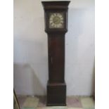 An oak Philips Bromyard single hand brass faced long case clock