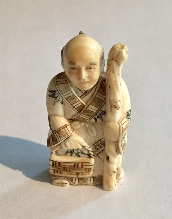 Two ivory Netsukes, one depicting a man holding a staff- signature to underside, along with a - Image 8 of 11