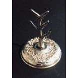 A hallmarked silver "Boots Pure Drug Co." ring stand