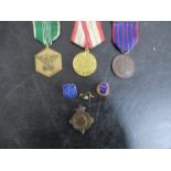 A small collection of medals, medallions and badges including Russian
