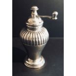 A continental silver pepper mill, marked 800