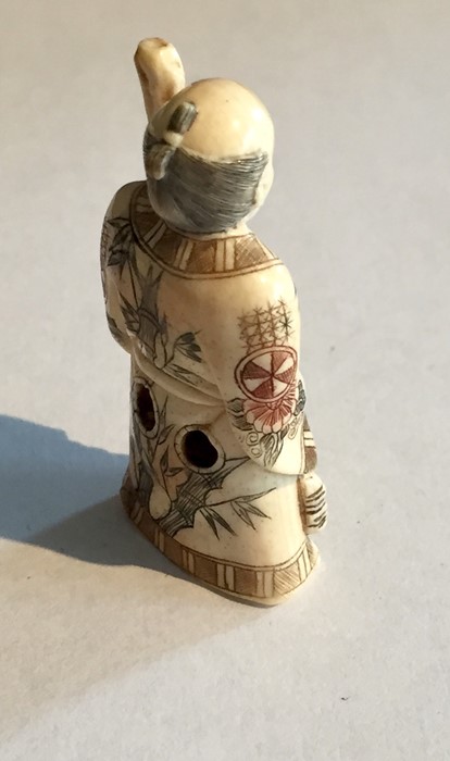 Two ivory Netsukes, one depicting a man holding a staff- signature to underside, along with a - Image 10 of 11