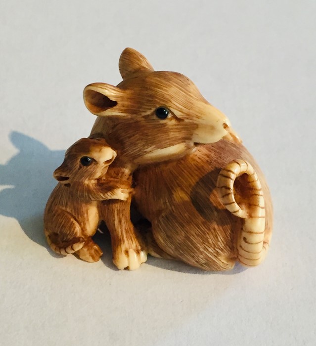 A 19th Century ivory Netsuke of a rat with its baby, signature to underside