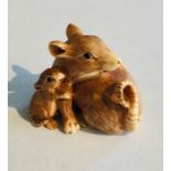A 19th Century ivory Netsuke of a rat with its baby, signature to underside