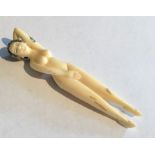 A 19th century ivory Netsuke of a female nude figure, signature to reverse