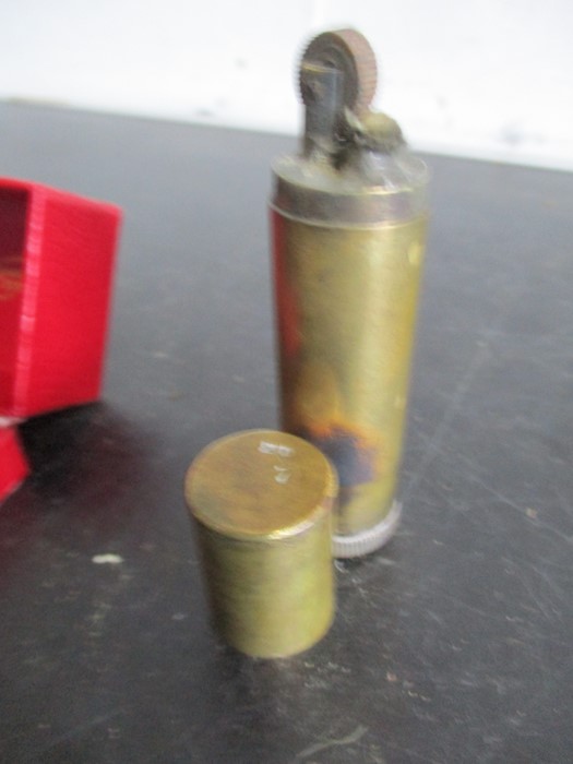 An aeroplane compass with broad arrow stamp, metal map case, trench art lighter along with a perspex - Image 5 of 13