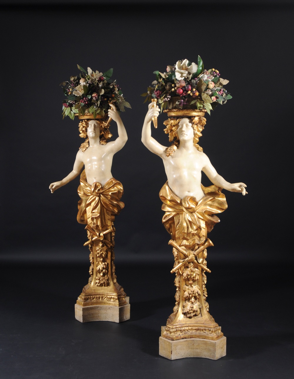 PAIR OF HERMS CARRYING FLOWERS