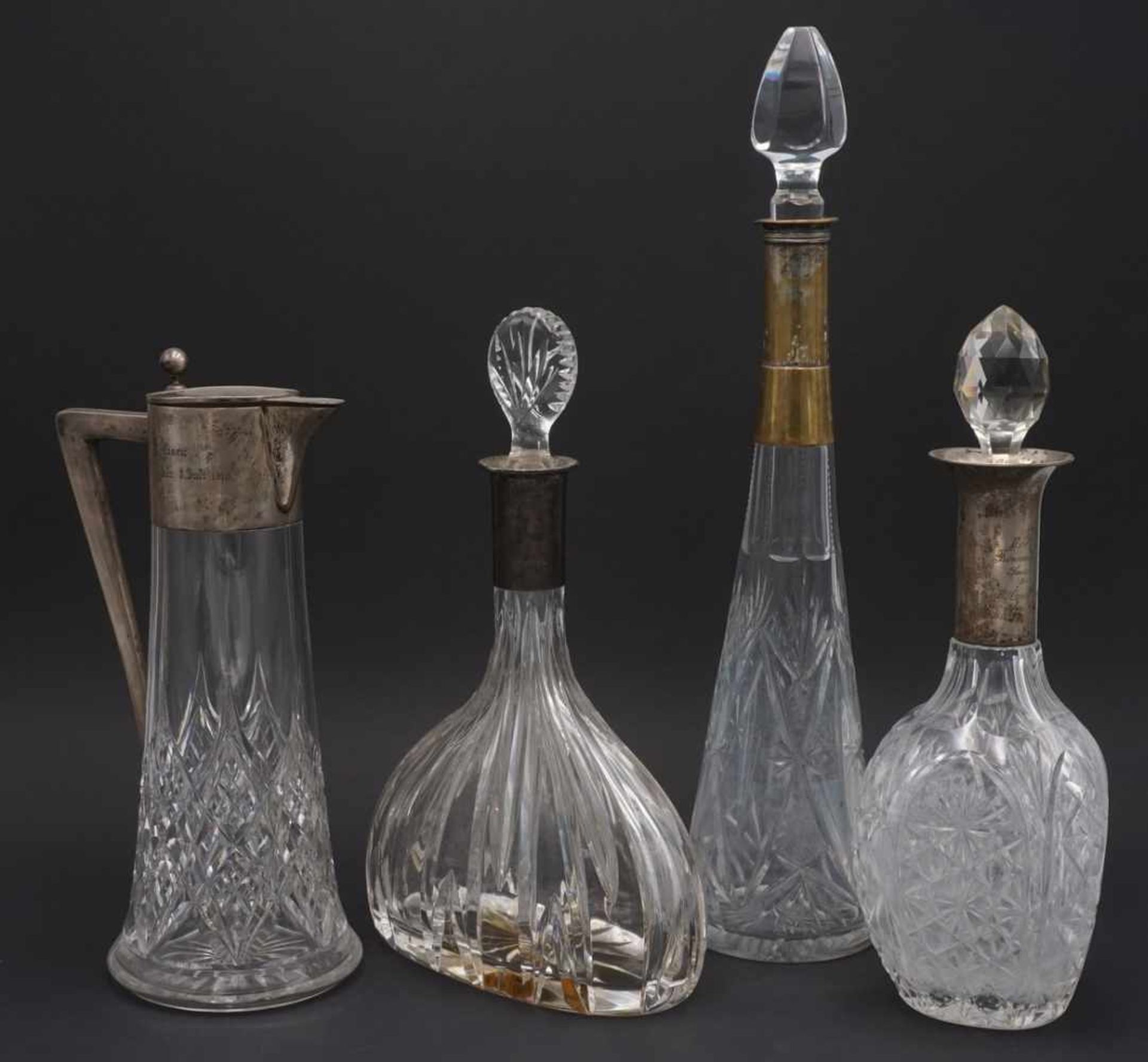 Vier Kristallkaraffen, 1. Hälfte 20. Jh.Kristallglas, altersgemäßer Zustand, stellenweise bestoßen