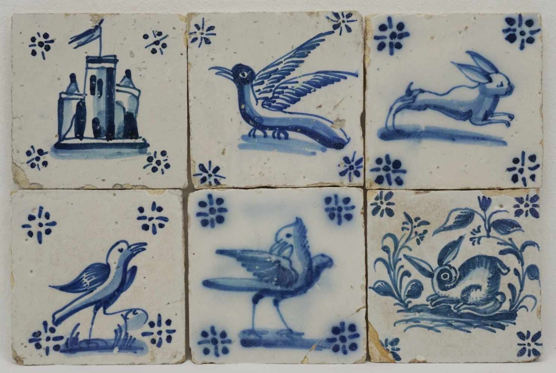 Sechs Fliesen, Portugal18. Jh., blau, eine Burgen, zwei Hasen- und drei Vogeldarstellungen,