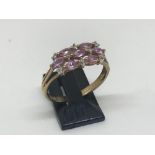 9ct yellow gold pink sapphire and diamond ring.