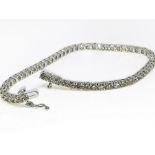 9ct white gold tennis bracelet with 5ct in diamonds.