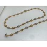 9ct yellow / white gold necklace with matching bracelet set.