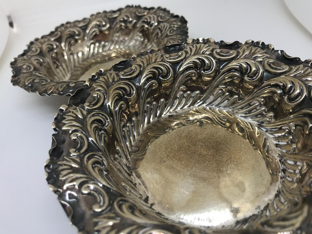 Pair of silver repousse dishes
