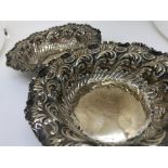 Pair of silver repousse dishes