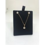 9ct yellow gold CZ pendant and earrings suite.