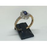 9ct yellow gold, sapphire and diamond ring