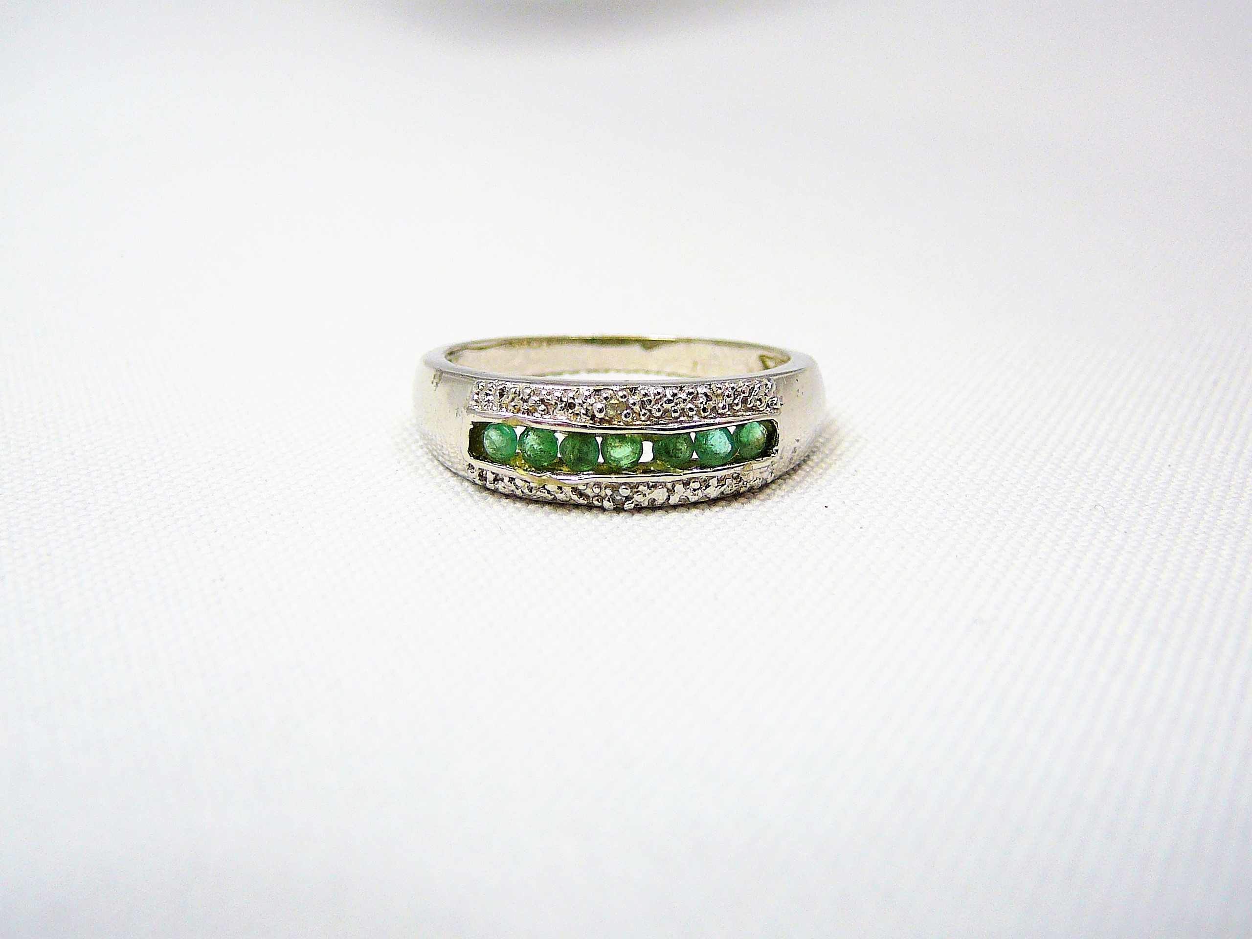 Silver emerald and diamond ring