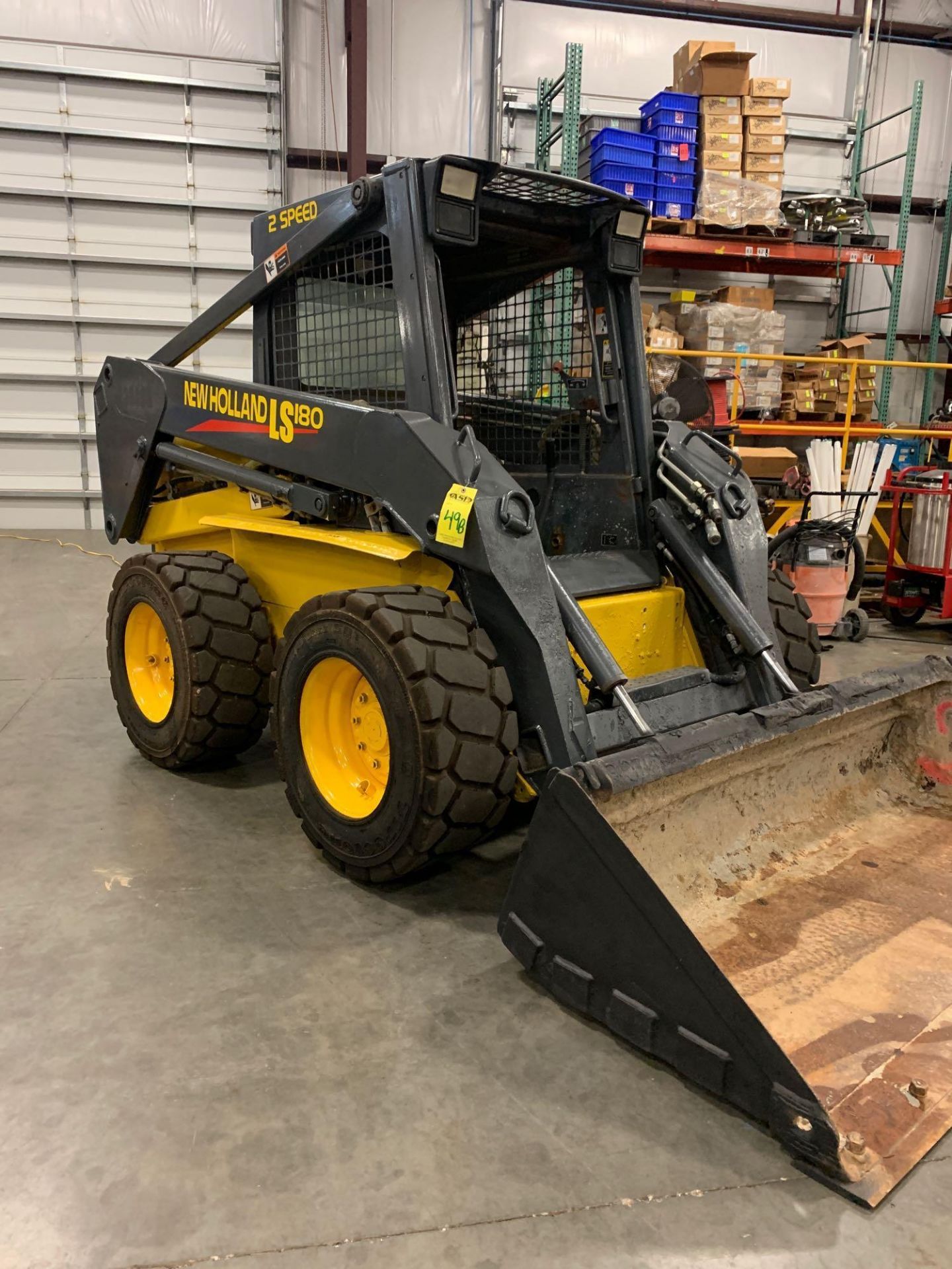 NEW HOLLAND LS180 SKID STEER, DIESEL POWERED, 2-SPEED, SUPERBOOM, 72” BUCKET, RUNS AND OPERATES