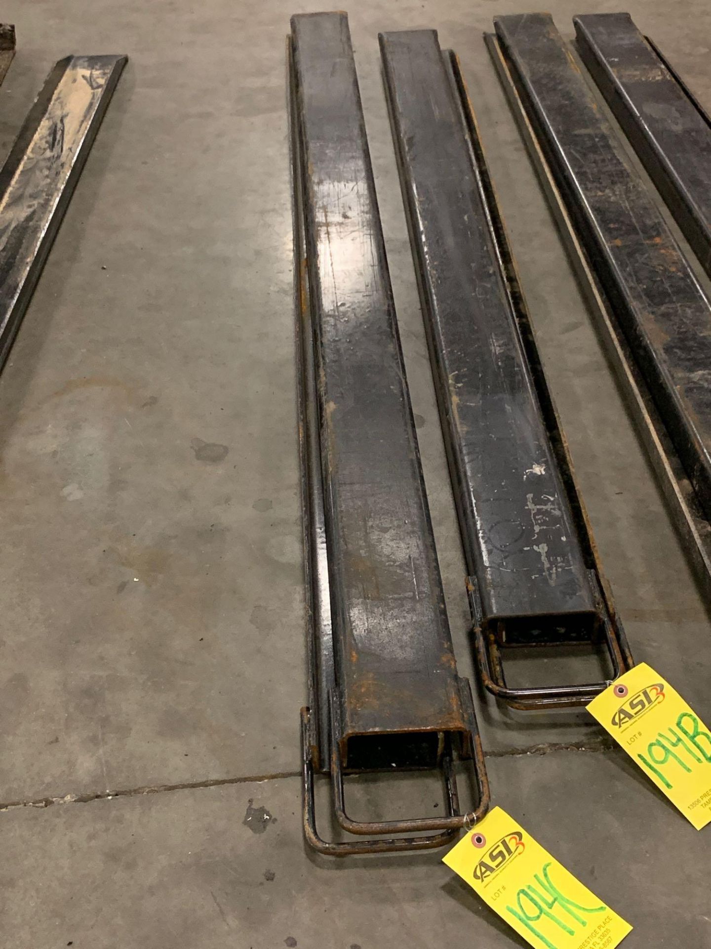 SET OF UNUSED FORKLIFT FORK EXTENSIONS