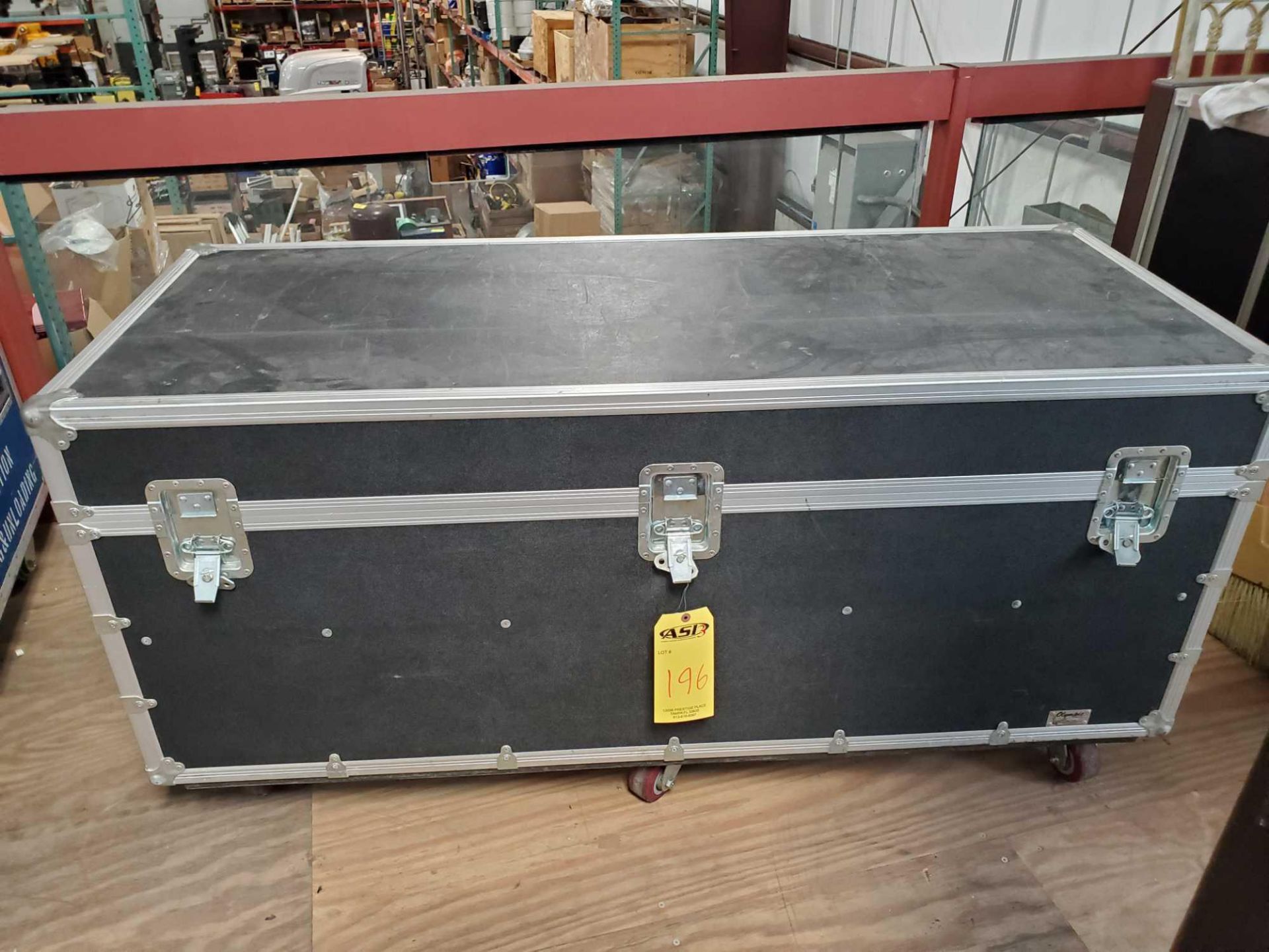 OLYMPIC CASE COMPANY HARD CASE W CASTERS AND 4 ROLLS OF FLOOR VINYL.