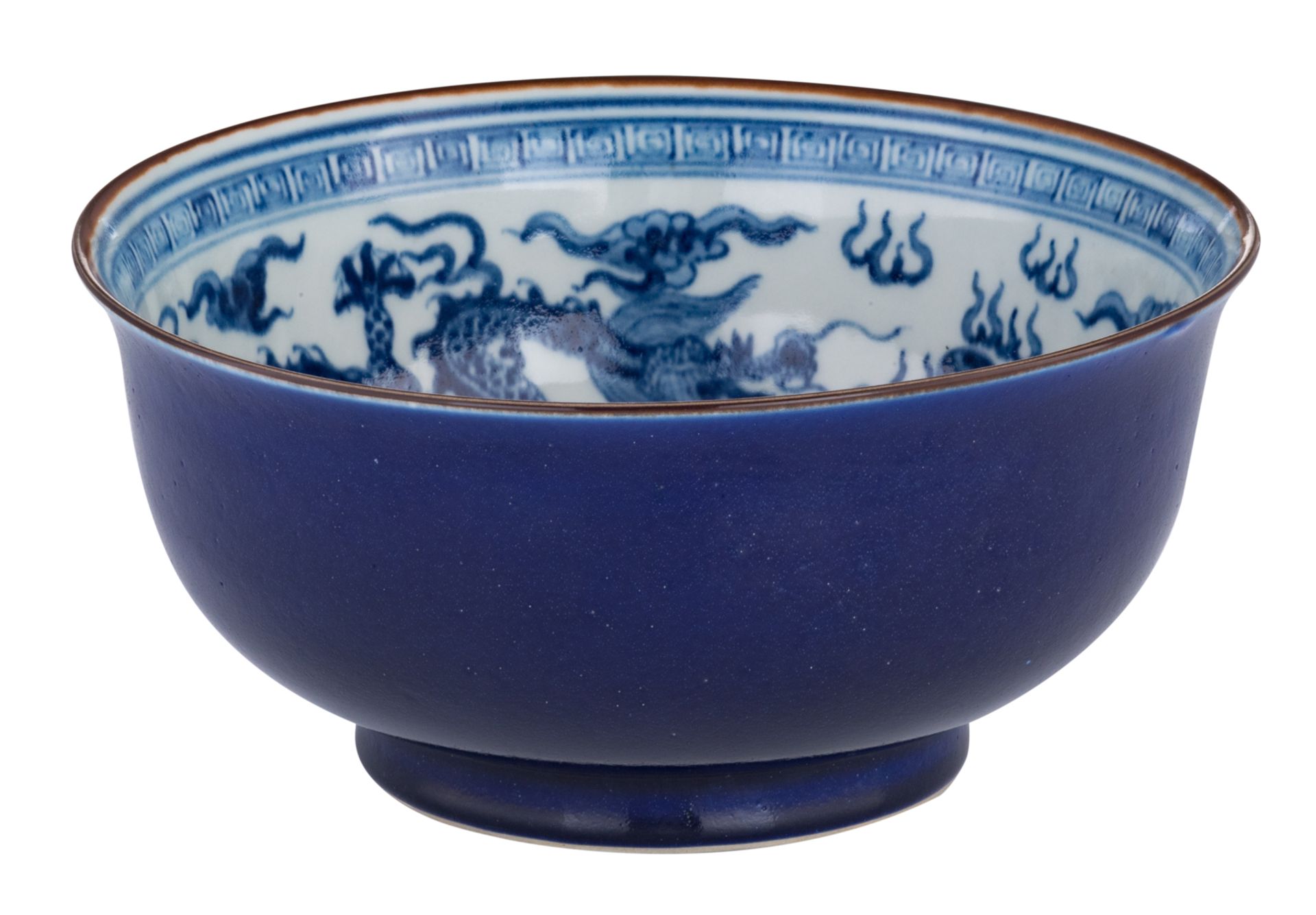 A Chinese blue and white deep bowl, decorated with dragons chasing the pearl, with a Xuande mark, la