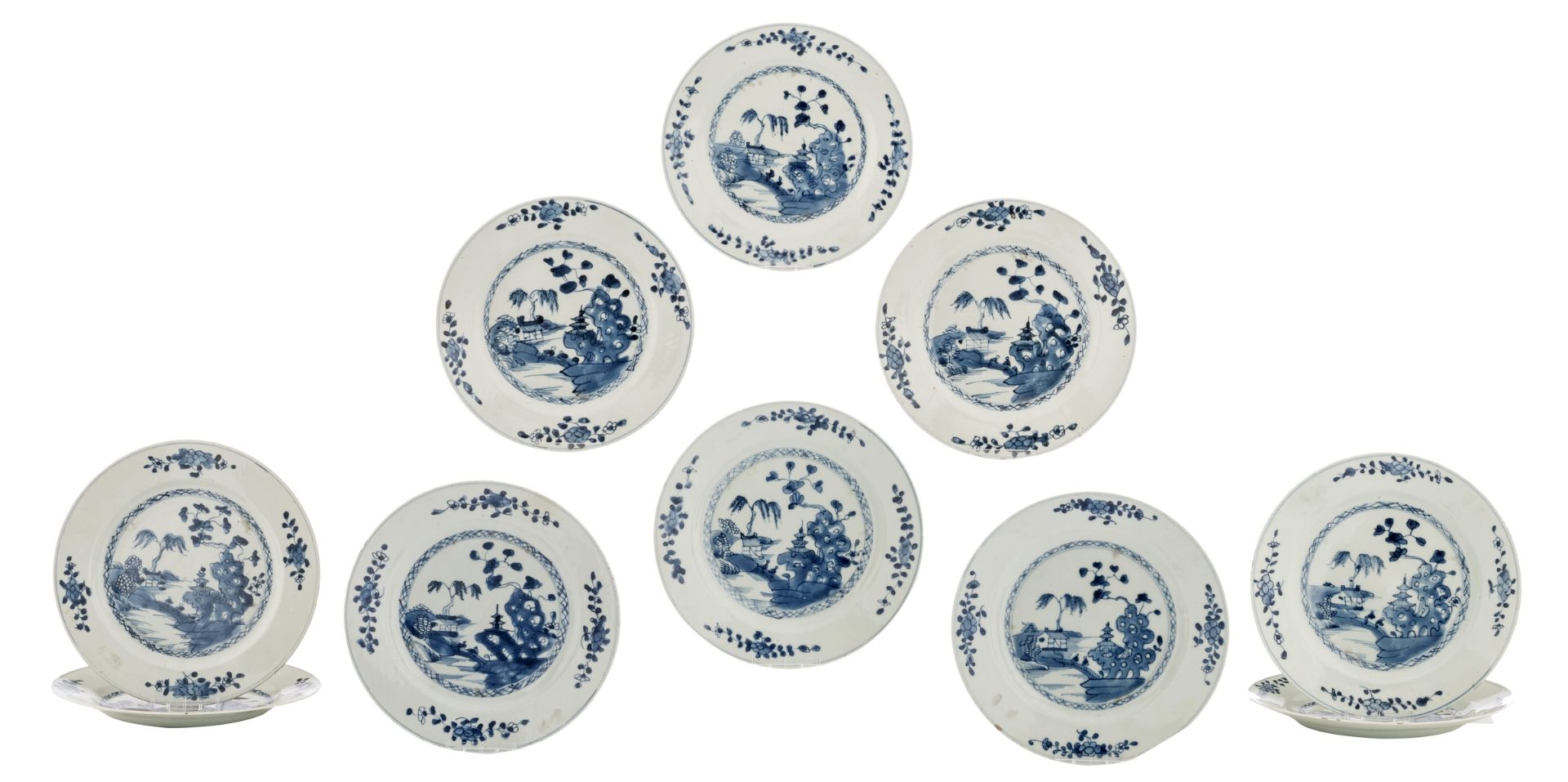 A lot of ten Chinese blue and white porcelain dishes, decorated with pavilions and pagoda in a river