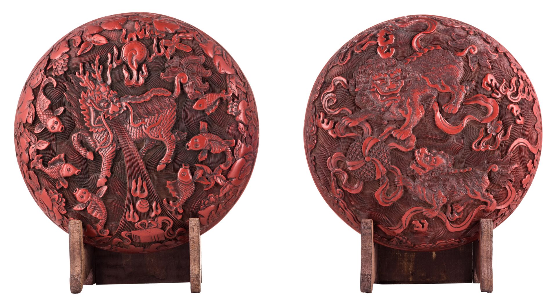 A Chinese Peking cinnabar lacquer box, both sides richly carved, one side with lions, one side with