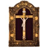 An 18thC ivory corpus Christi mounted in a gilt wooden frame, H 24 cm (corpus) - 44 x 66 cm (frame)
