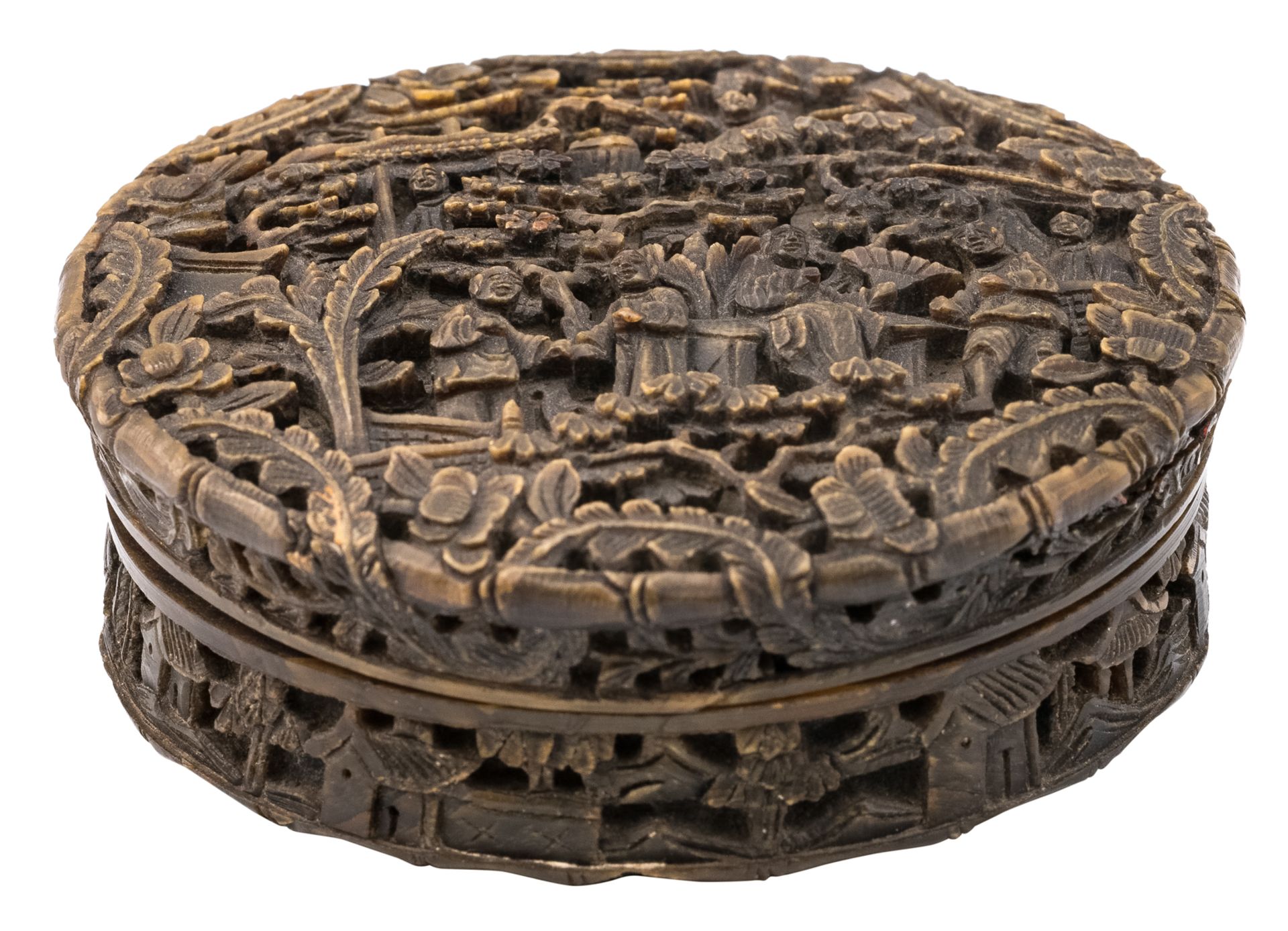 A Chinese tortoiseshell box and cover of flattened circular form, overall relief carved with figures