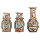 A Chinese famille rose Canton bottle vase, decorated with court scenes, birds and flower branches,