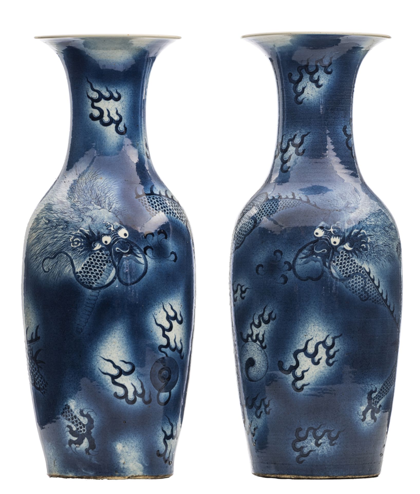 A pair of Chinese blue and white vases, decorated with a dragon chasing the flaming pearl, 19thC, H