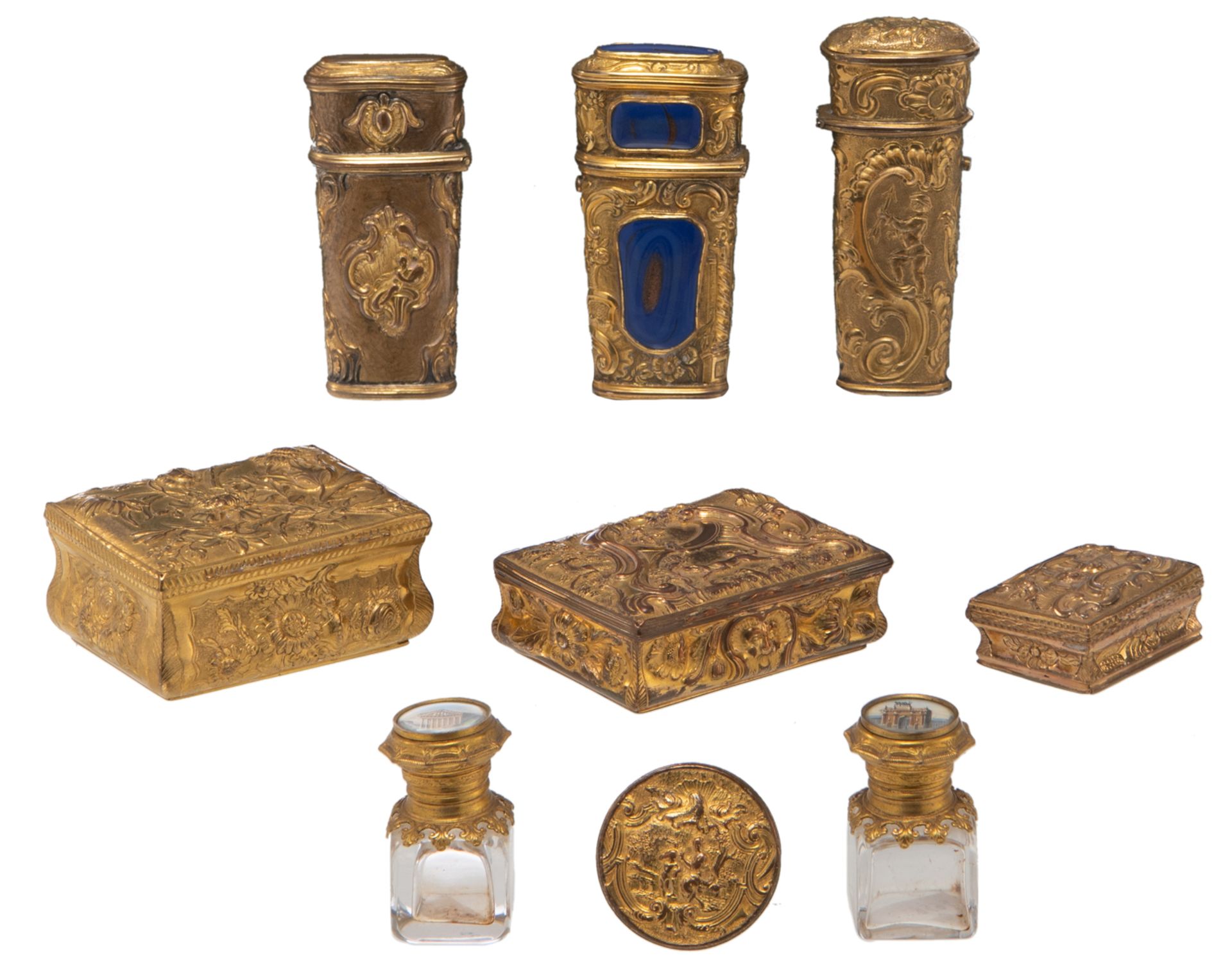A charming lot of various objets de vertu, all made out of relief decorated gilt brass, added two so