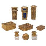 A charming lot of various objets de vertu, all made out of relief decorated gilt brass, added two so