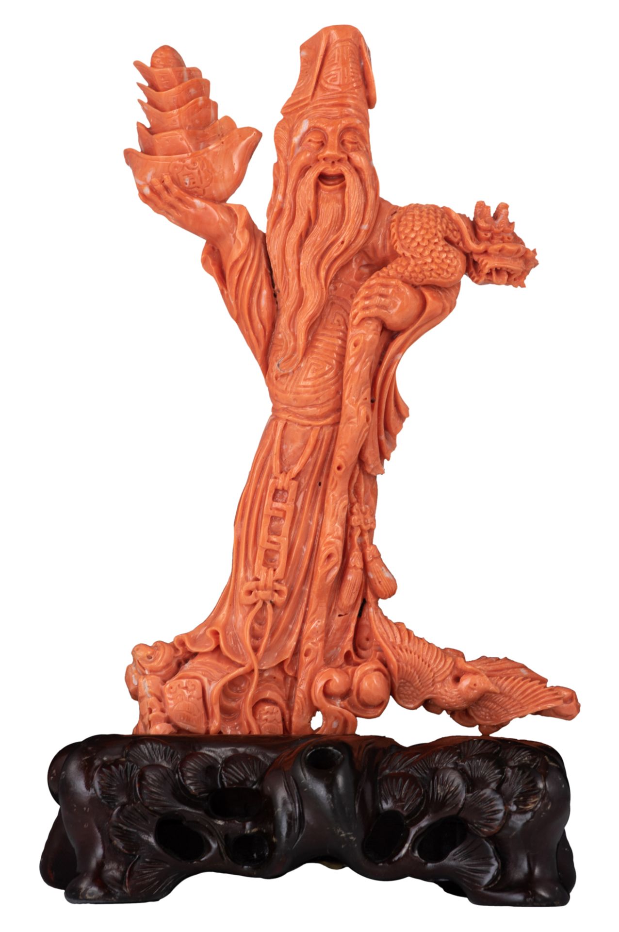 A fine red coral sculpture, depicting Tsai Shen Yeh, the God of Wealth, on a matching hardwooden bas