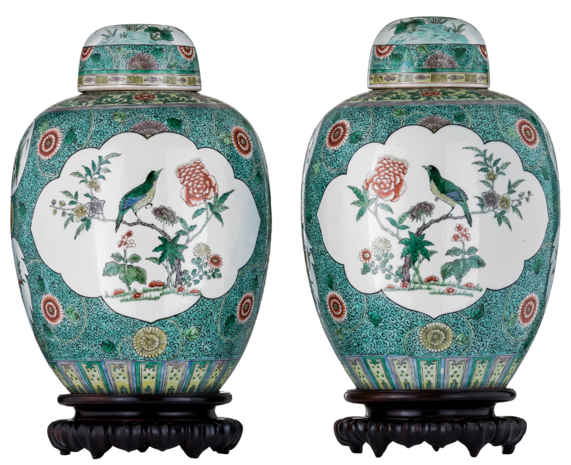 Two large famille verte baluster shaped jars and cover, of baluster shape, richly decorated with nat