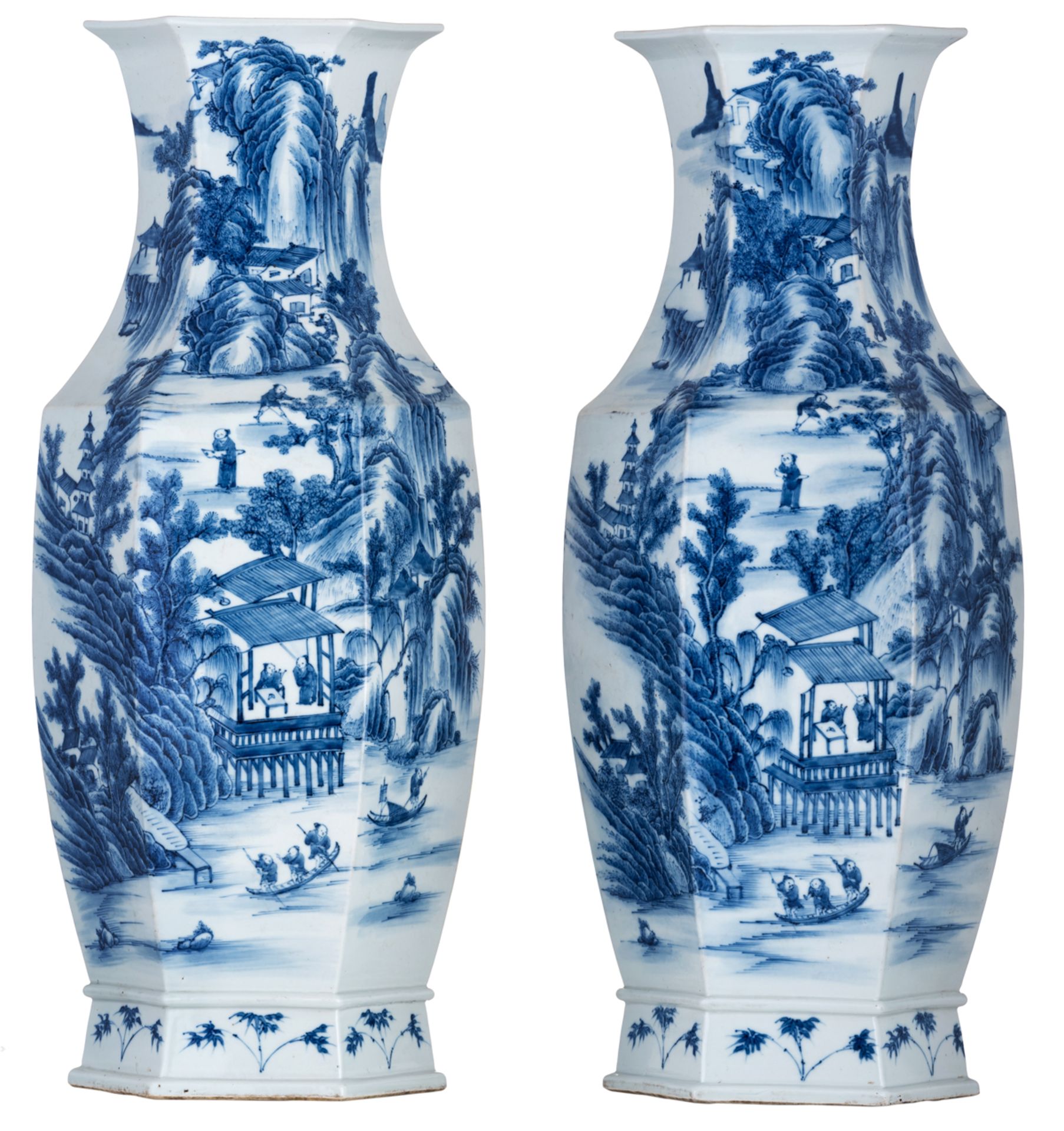A pair of Chinese blue and white hexagonal vases, overall decorated with pavilions and figures in a