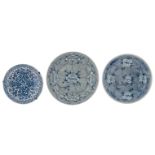 A lot of Japanese Arita blue and white porcelain plates, consisting of two large and a smaller plate