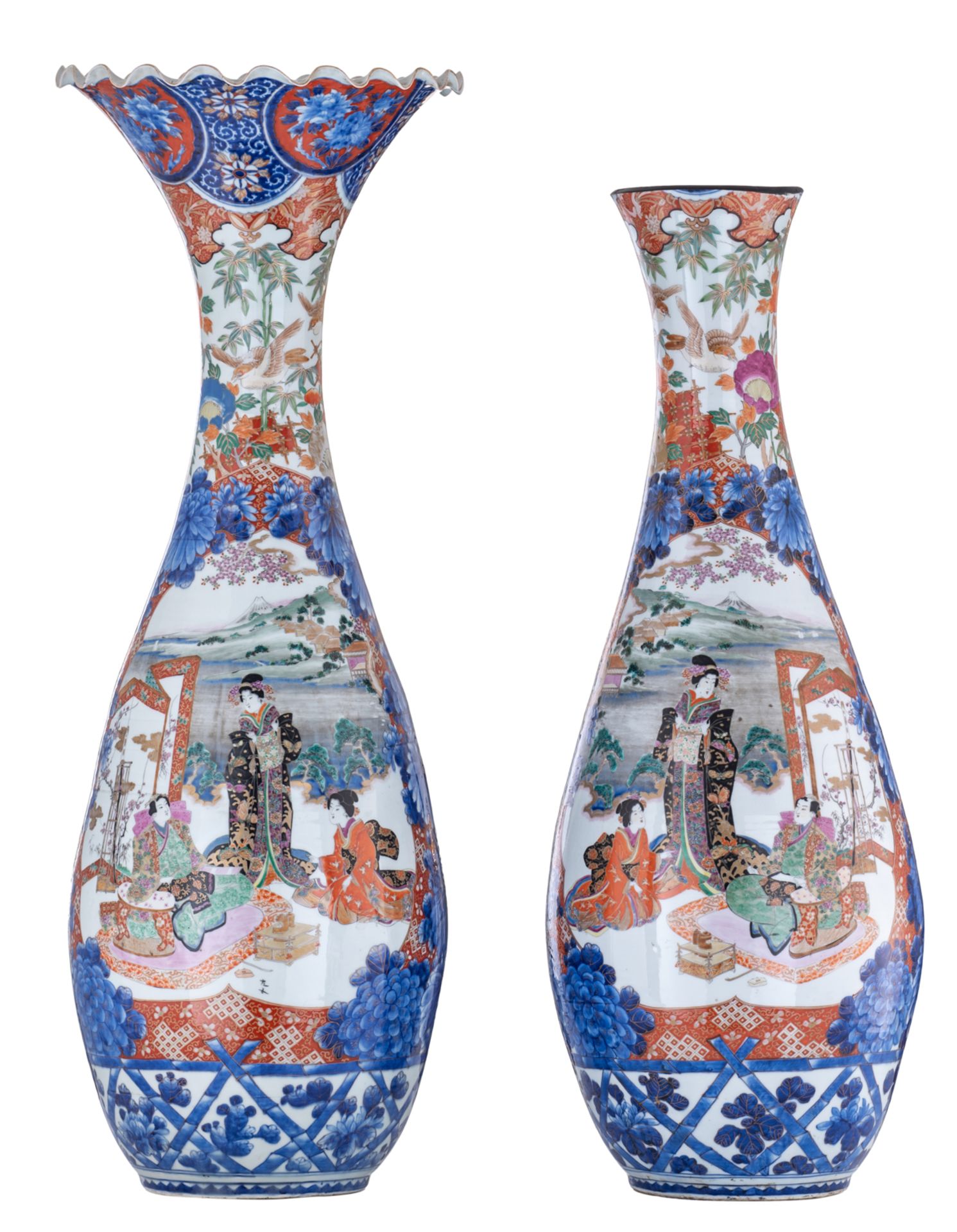A large pair of Japanese polychrome floral vases, overall decorated with birds and an animated scene