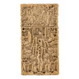 A fine sculpted Chinese ivory card case with figures in a garden and terrace setting, last quarter o