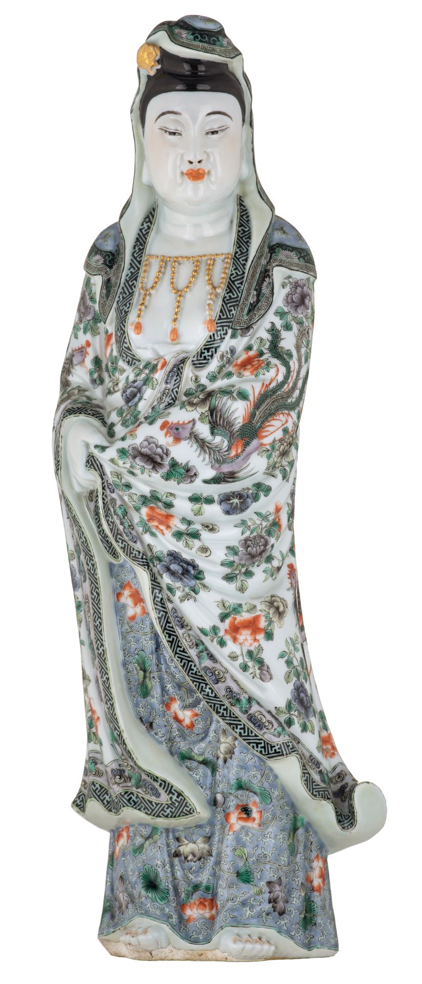 A Chinese polychrome and floral decorated Guanyin, the garment decorated with mythical birds, marked