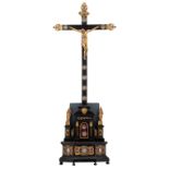 A 19thC ebonised wooden reliquary crucifix containing, a fragment of the True Holy Cross of Christ i