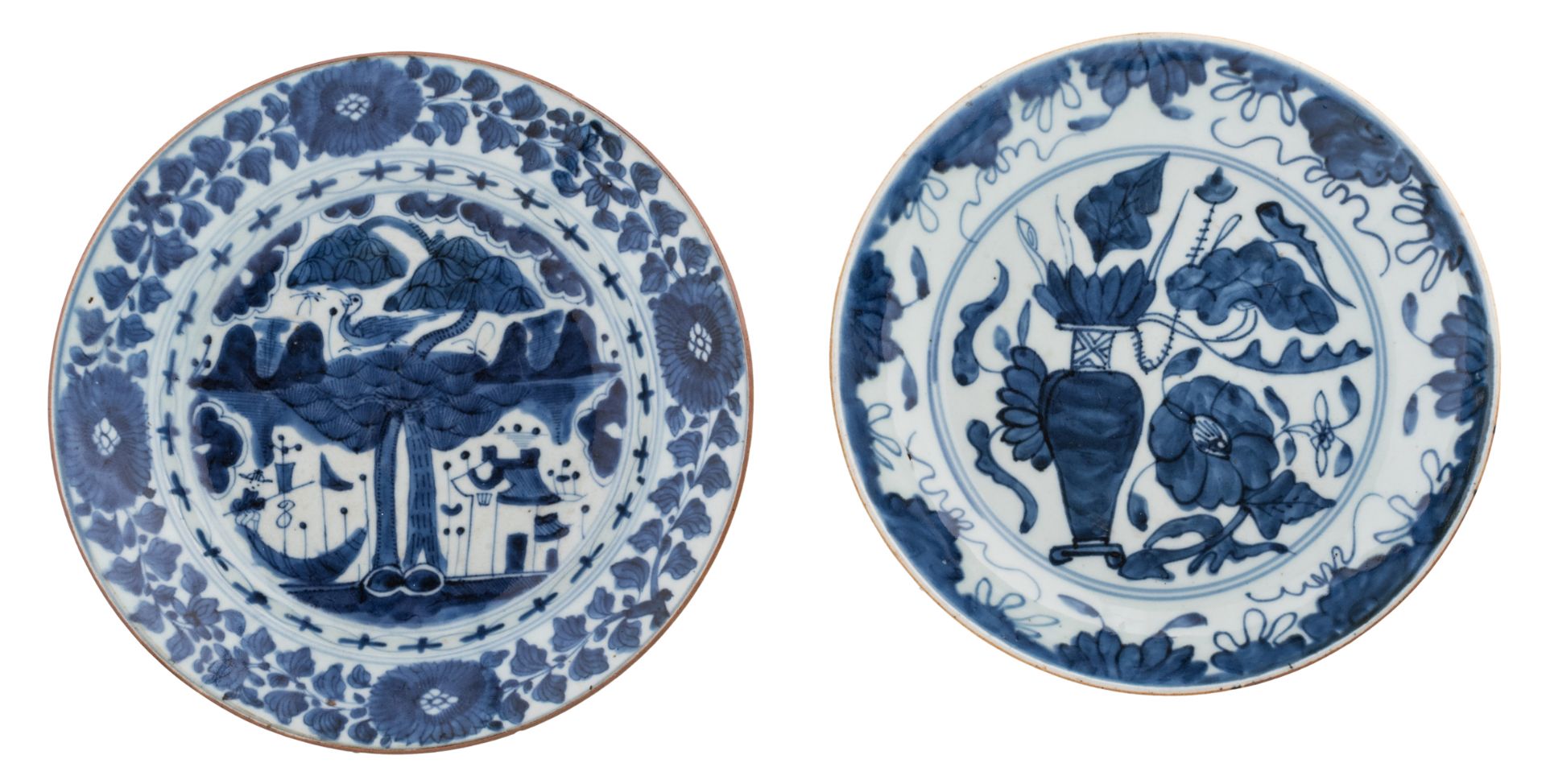 Two Chinese blue and white saucers, decorated with a flower pot and a riverlandscape, later 17thC, ø