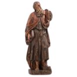 An 18thC Southern German polychrome painted wooden sculpture depicting an Evangelist, H 83 cm