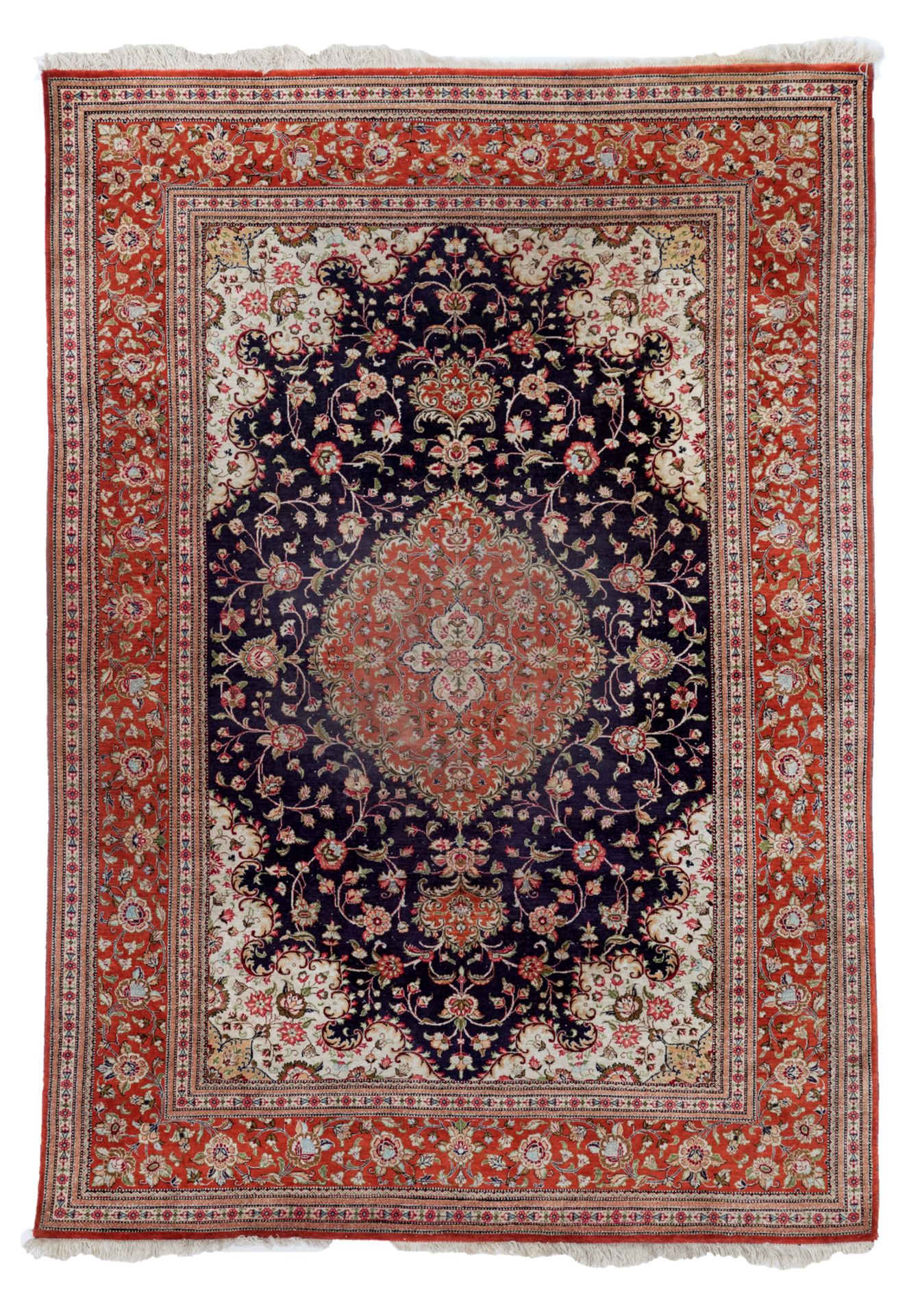 An Oriental silk carpet with floral motifs, 138 x 198 cm