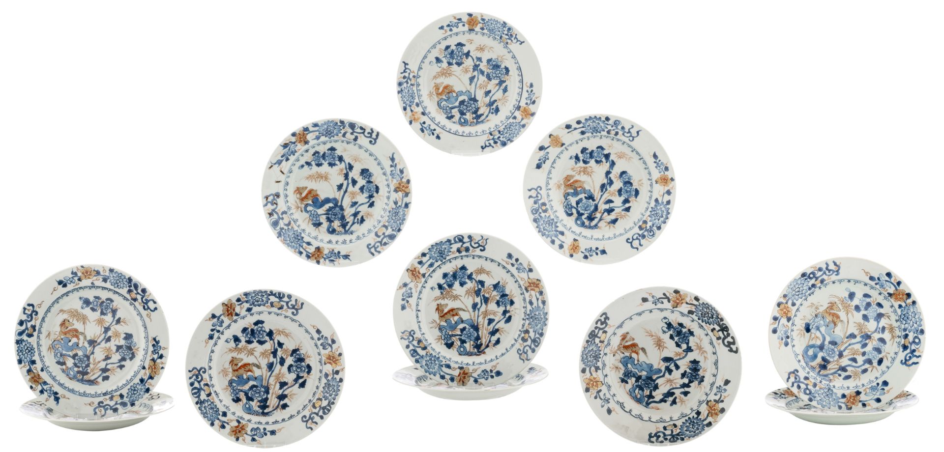 A lot of eleven Chinese Imari porcelain dishes, decorated with a Qilin on a rock, surrounded by bamb