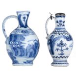 Two Japanese Arita blue and white jugs, decorated with figures in a landscape, one with a silver mou