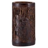 A sculpted bamboo brushpot decorated to one side with an erotic scene, the reverse with a tekst, tel